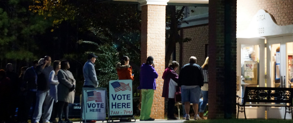 voters lined up in dark